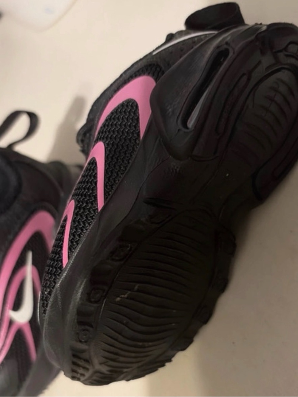Nike Kids Black Sneakers with Pink Swoosh Accents